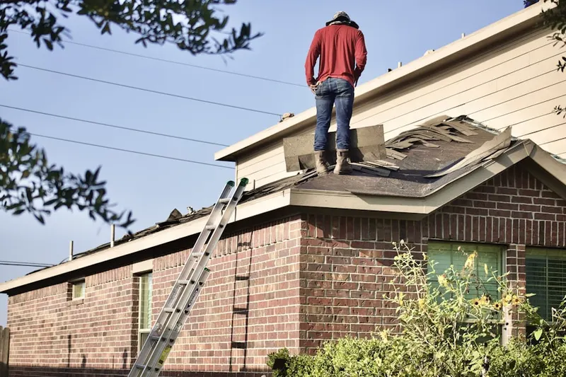 Professional roofer working on a residential roof in Keansburg